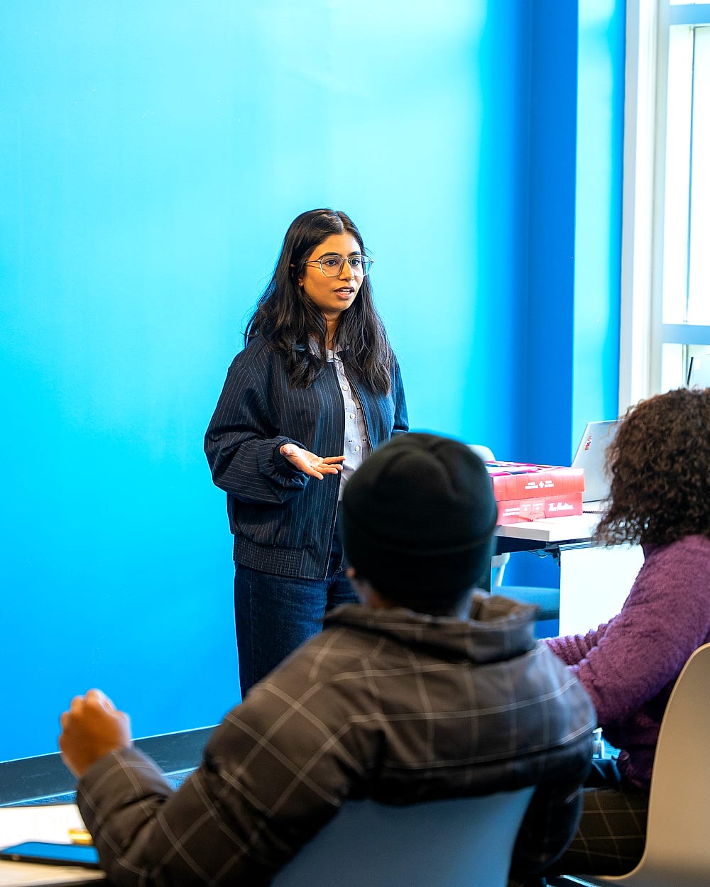 Shiwani speaking with residents at a community session